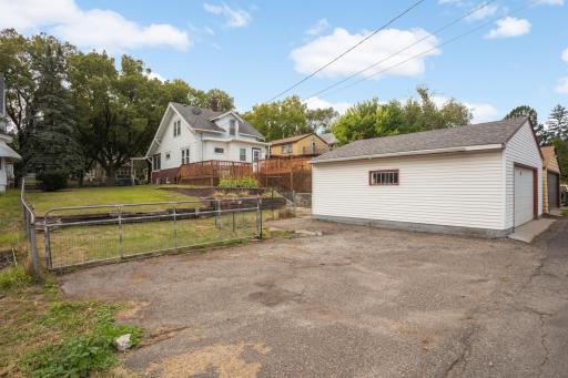 Oversized detached garage with off-street parking and a fenced backyard