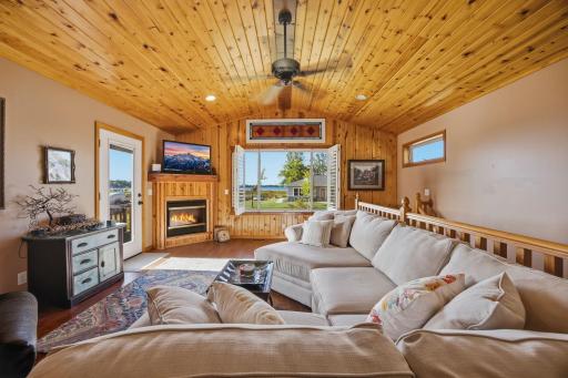Quaint and cozy living room with a gas fireplace and check out the lake through the window!