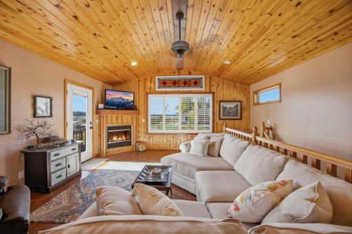Awesome sunshine coming in from the clear glass door leading outside to the deck and the great lake views.