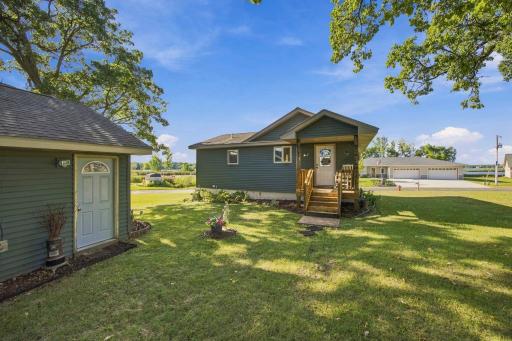 The garage is an oversized one stall offering great storage options. Cute, covered porch greets you from this side of the home.