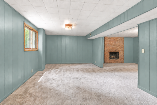 Lower level has brand new carpet and fresh paint. This photo has been digitally enhanced.