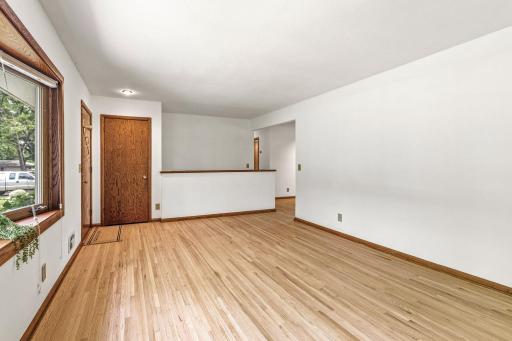 Living room has a helpful coat closet for guests entering through the front door.
