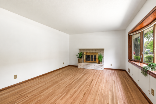 Expansive bay windows with beautiful lighting for the living room.