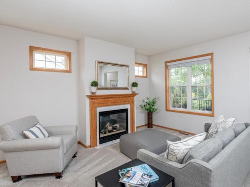 Cozy gas-burning fireplace creates a warm and inviting focal point for the living area.