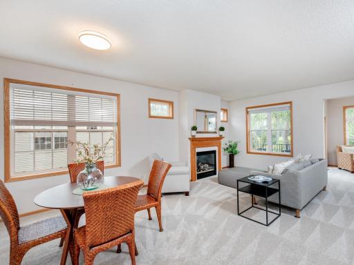 Light and bright open-concept living and dining area offers a welcoming space for everyday living and entertaining.