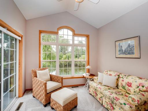 Wonderful sunroom with a vaulted ceiling. Easily access the deck, perfect for entertaining and enjoying the outdoors.