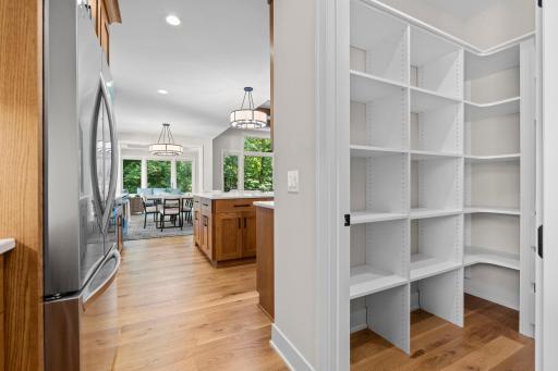 Thoughtfully designed pantry with custom built-ins, offering added storage and the functionality of a butlerâs pantry.
