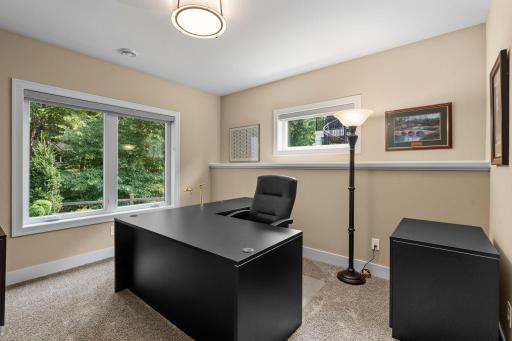 Lower-level Bedroom 3 features a spacious walk-in closet and lookout views.
