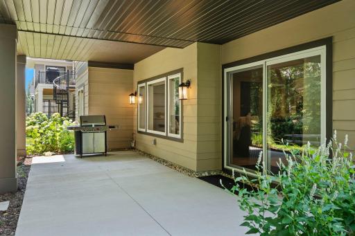 Private lower-level patio with direct walkout access, extending the living space outdoors.