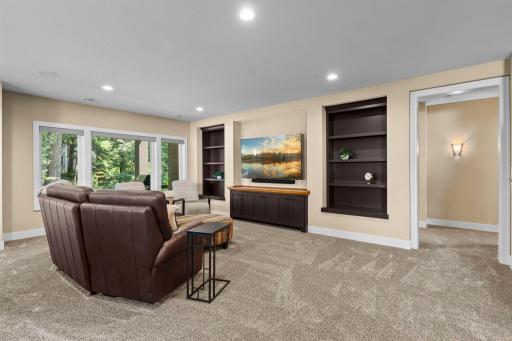 Lower-level family room featuring a spacious layout and integrated Sonos sound system.