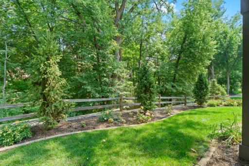 Private, wooded backyard offering a peaceful natural setting.