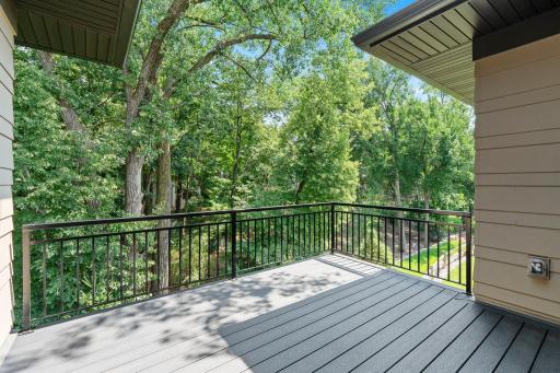 Deck overlooking wooded views, offering a natural setting to gather, unwind, and enjoy everyday living with a rough-in gas connection for a future fire pit.