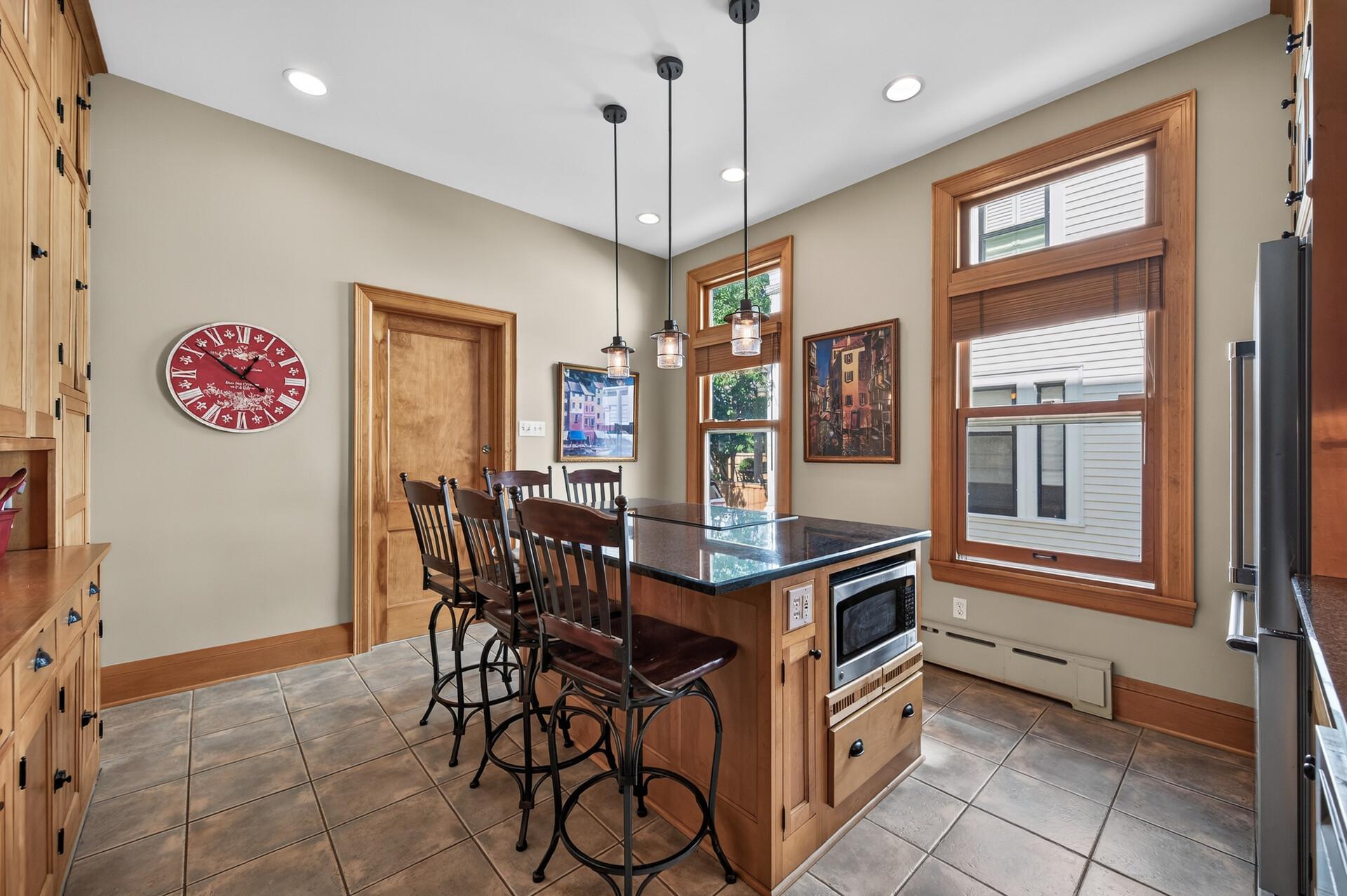 A kitchen island ready for everything from morning coffee to late-night conversations.