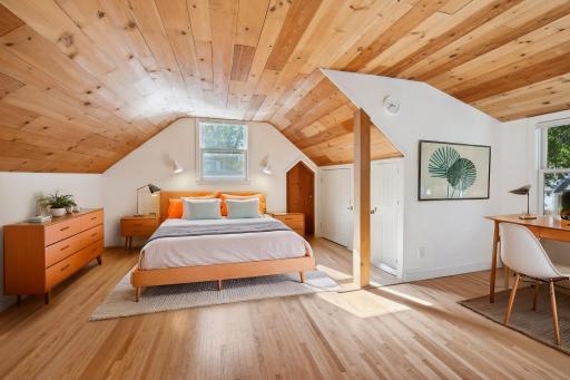 Upper-level bedroom that has been recently refinished. Virtually stage photo.