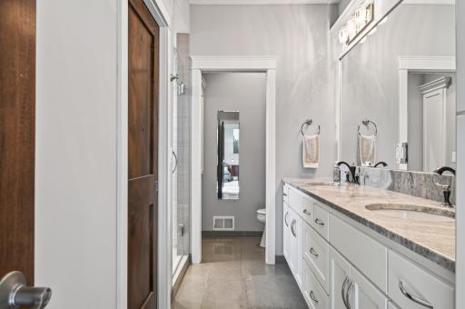 The primary walk in closet in behind the pocket door to the left.