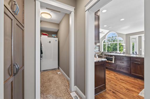 Off the kitchen is a closet area where the freezer is convenient.