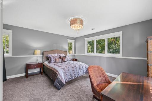 This lower level bedroom has many windows and lots of room.