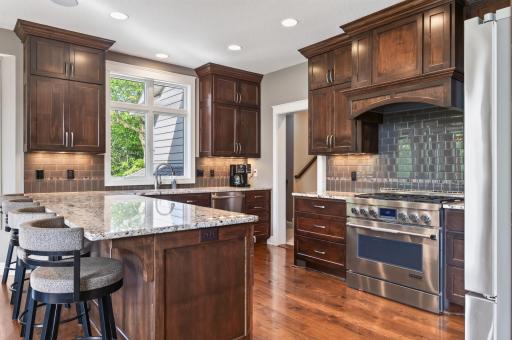 Granite countertops throughout the home. Ceiling height custom cabinetry provides storage for all your needs.