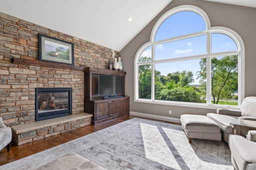 Built in cabinetry and a gas fireplace add warmth and comfort to the large living room.