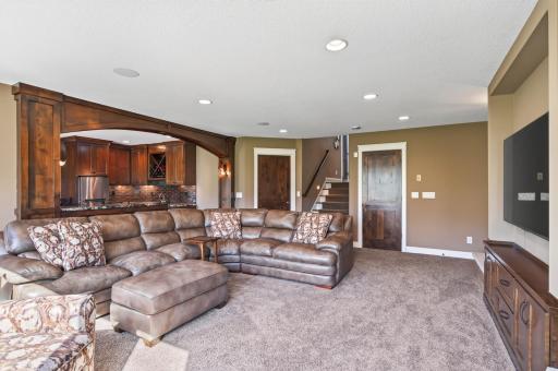 The family room is wired for surround sound to enjoy family movie night.