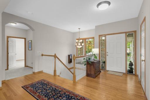 Spacious Foyer welcomes you with hardwood flooring and plenty of natural light from the sidelights surrounding the front door. The open layout provides an inviting first impression and easy access to the main living areas.