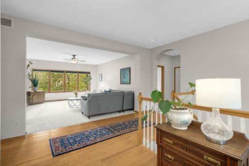 The open Foyer flows directly into the generously sized Living Room, providing a great sense of space as soon as you enter. Hardwood flooring transitions into brand-new carpet in the Living Room.