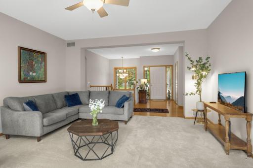 Looking back toward the Foyer shows the open flow and generous proportions of the main level. The Living Room easily accommodates large furniture while still maintaining an open feel.