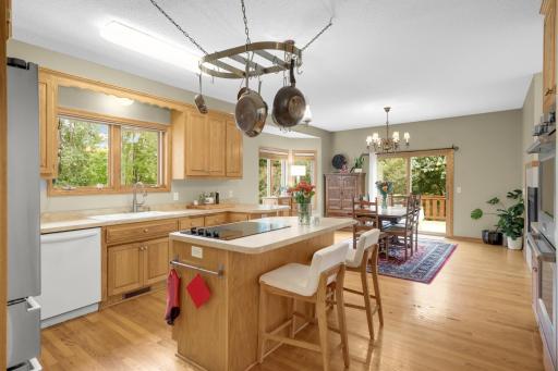 Open Kitchen and Dining area makes it easy to cook, entertain and stay connected with guests. Sliding doors provide convenient access to the deck.