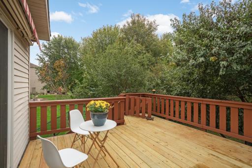 Surrounded by mature trees, the spacious deck offers a great outdoor setting for relaxing, dining or entertaining.
