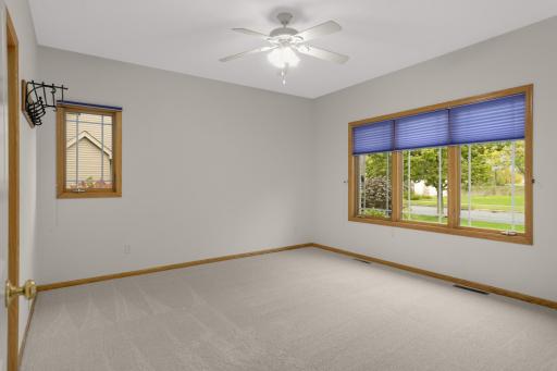 2nd Bedroom on the main level - Bright and spacious with large windows, new carpet and plenty of flexibility for furniture placement.