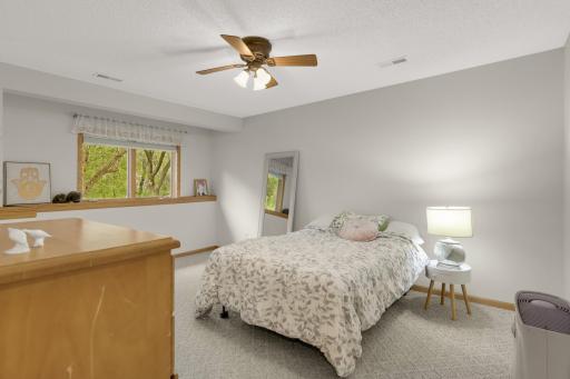 A second spacious lower-level Bedroom also features its own Walk-In Closet, making it a great option for guests, older kids or extended family