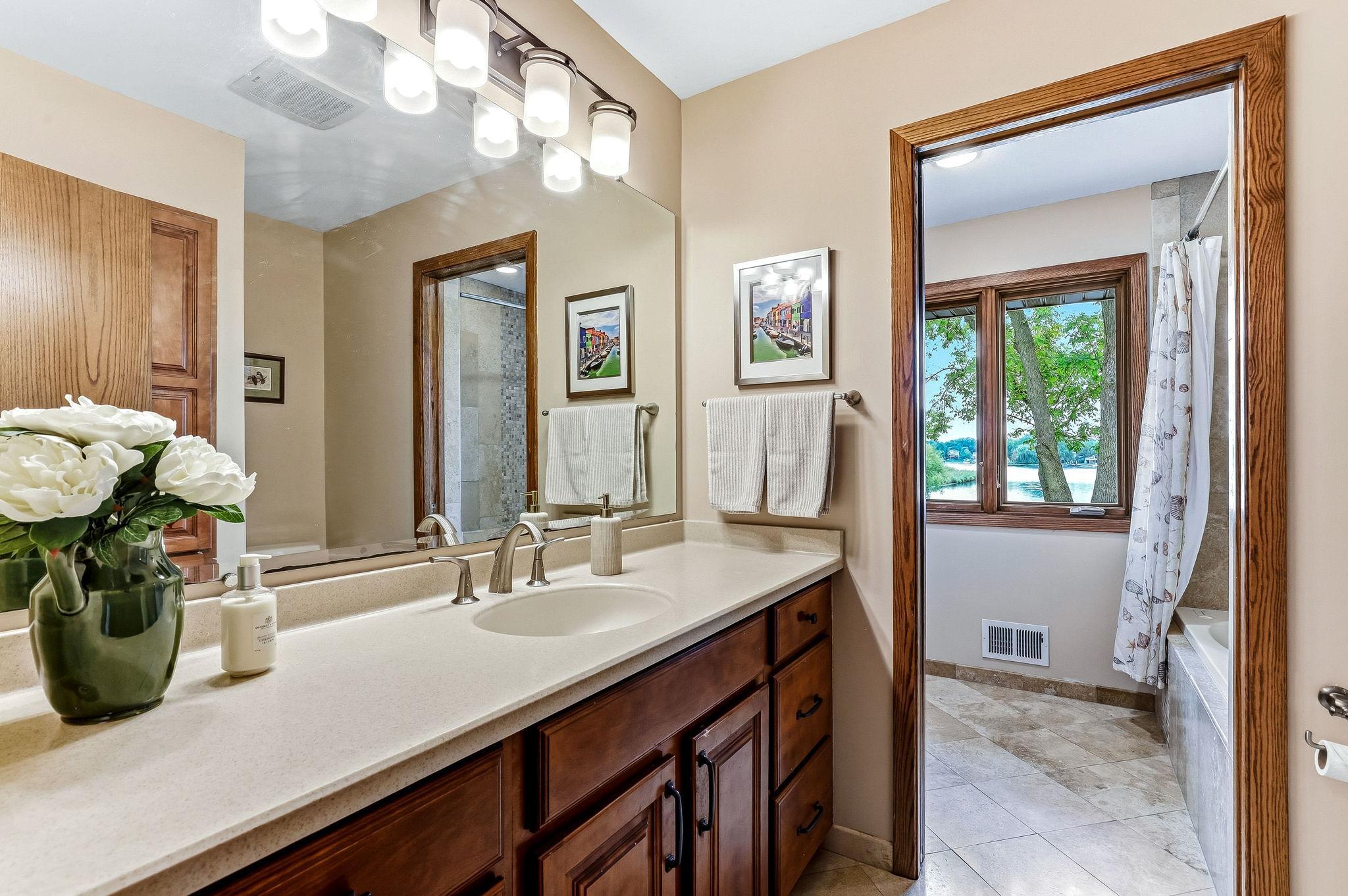 Full bathroom with tile floors on the upper level