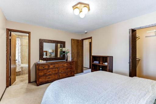 The primary bedroom has a walk-in closet and a private bathroom entrance