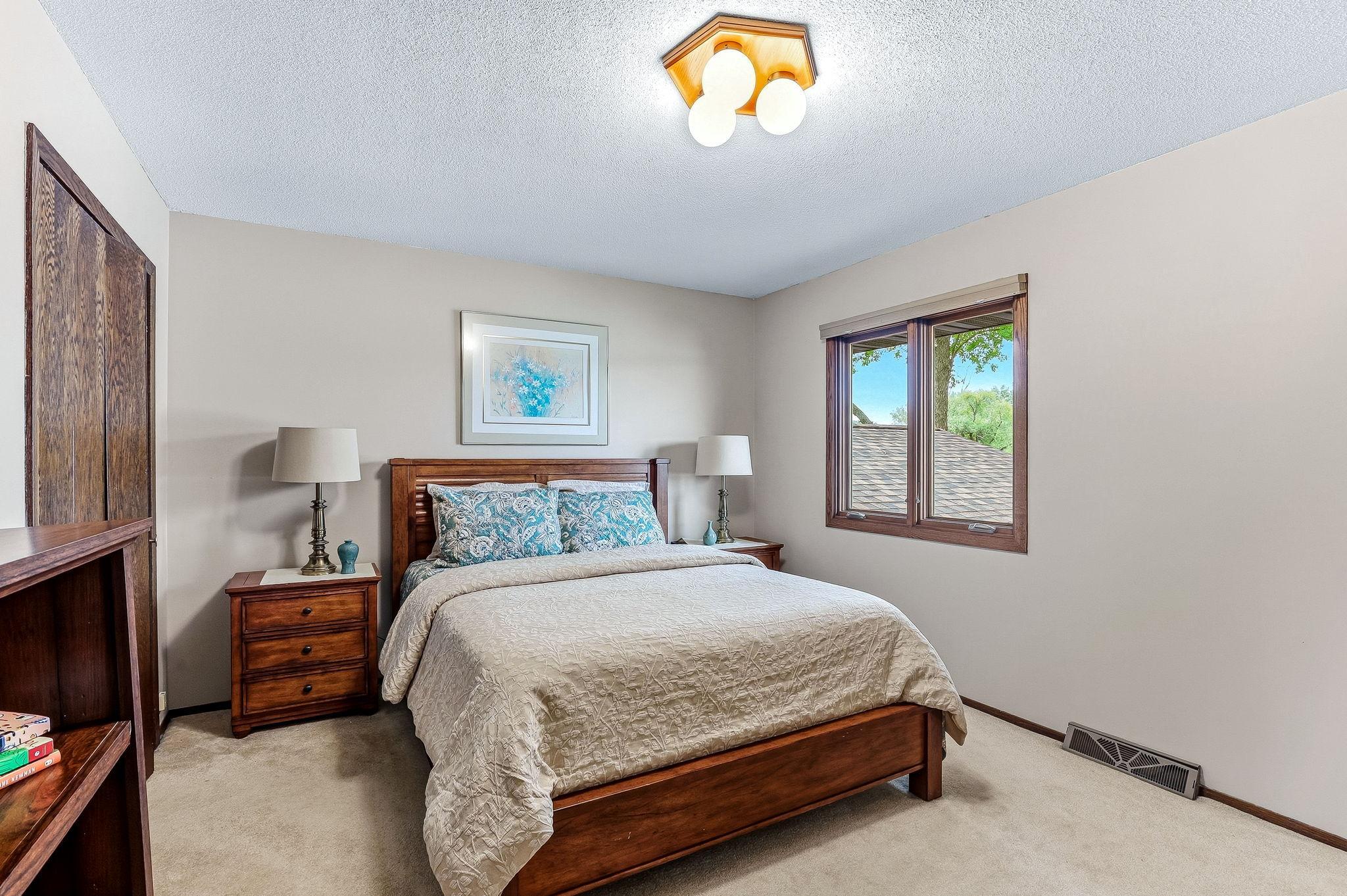Primary bedroom overlooks the lake