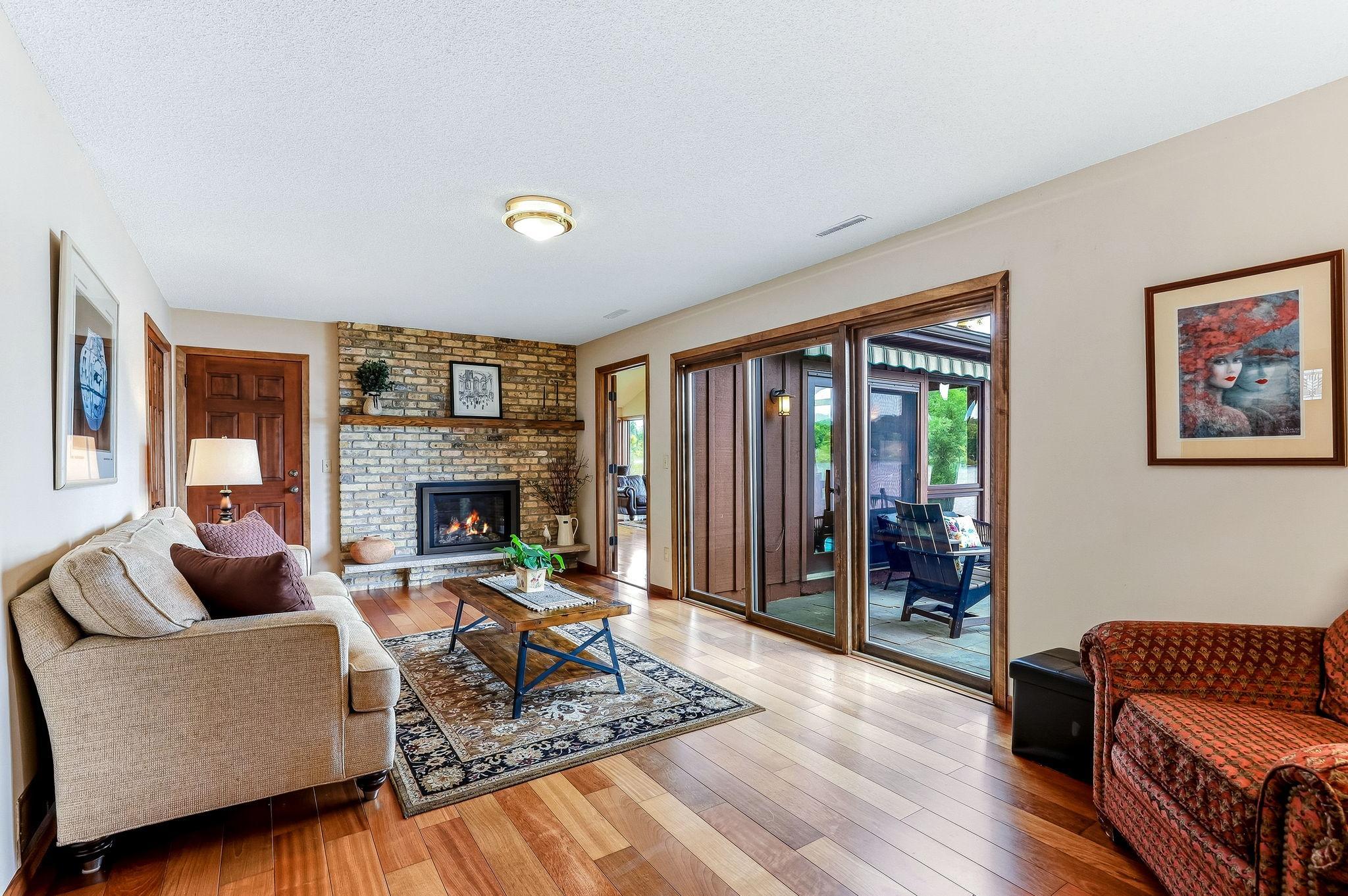 Family room with hardwood floors overlooking the main patio