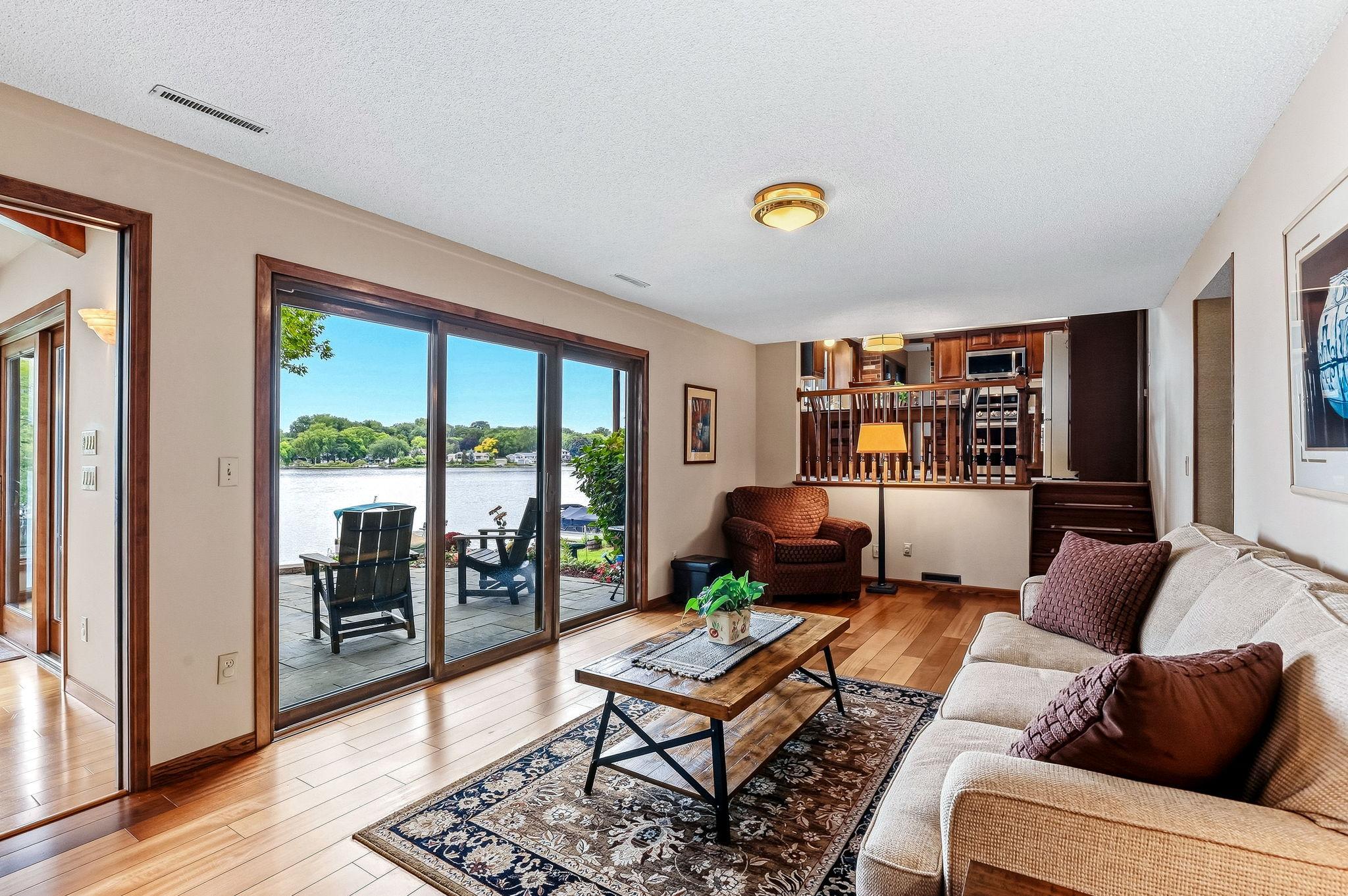 The family room looks out over the main patio and up into the kitchen area