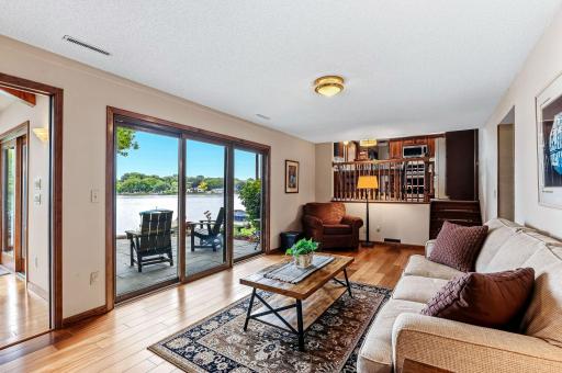 The family room looks out over the main patio and up into the kitchen area