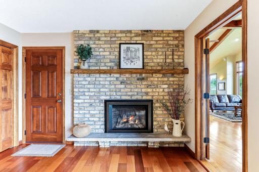Original brick fireplace with a modern gas insert