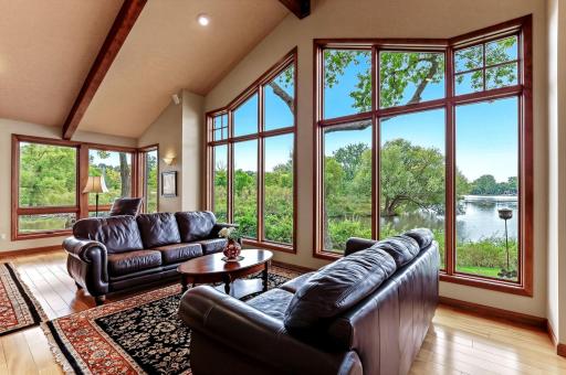 Expansive picture windows that capture the lake and nature