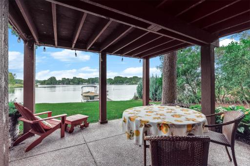 The lower patio is a casual spot to enjoy a book or a beverage
