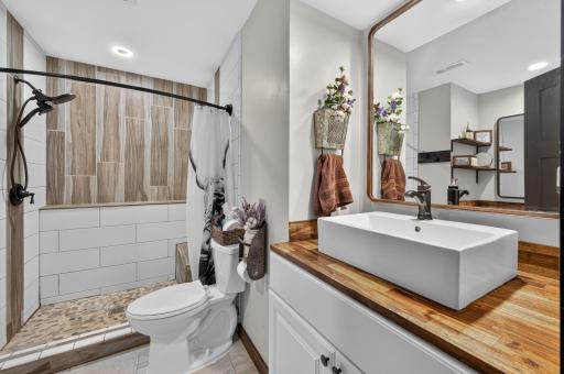 Lower level bathroom with a beautiful walk-in shower.