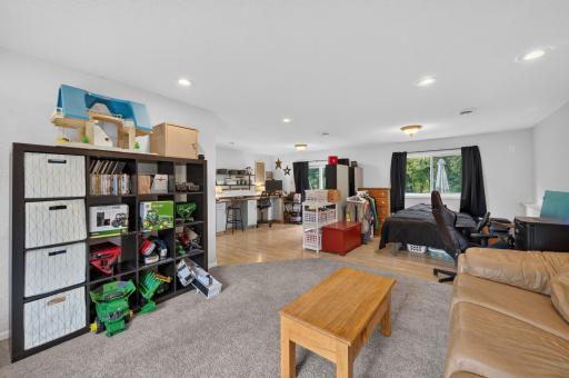 The elevated living room area is carpeted.
