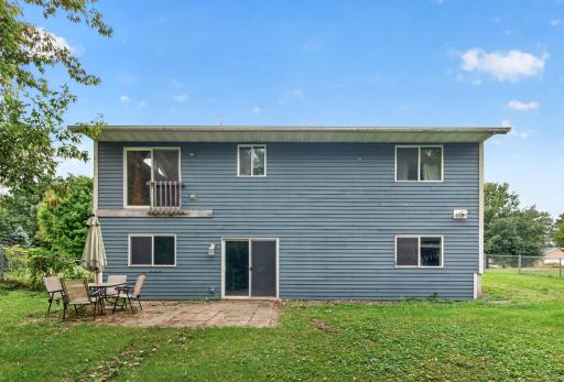 The lower level walks out onto a paver patio in the fenced in backyard.