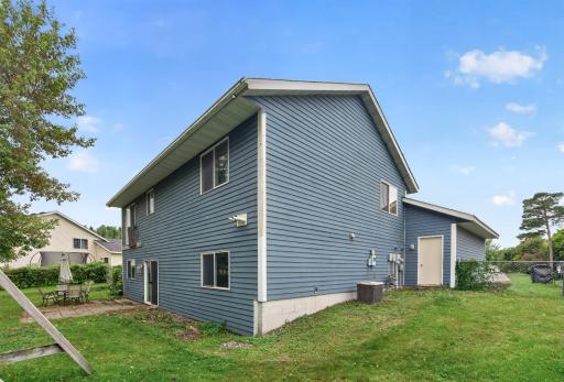 The 2 car garage has a rear door that walks out into the backyard.
