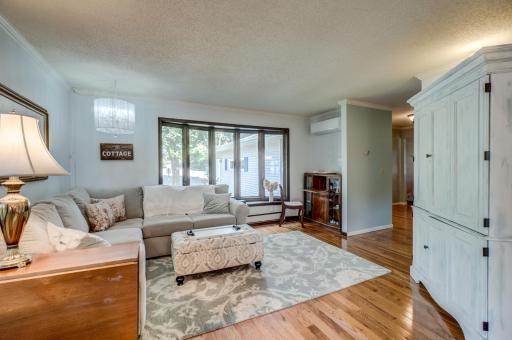 Light-filled and spacious, the main-level living room is perfect for gathering, and enjoying the views