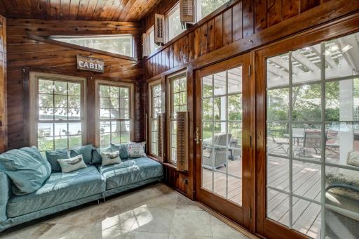 The four-season porch is the perfect place to enjoy the waterfront setting year-round!