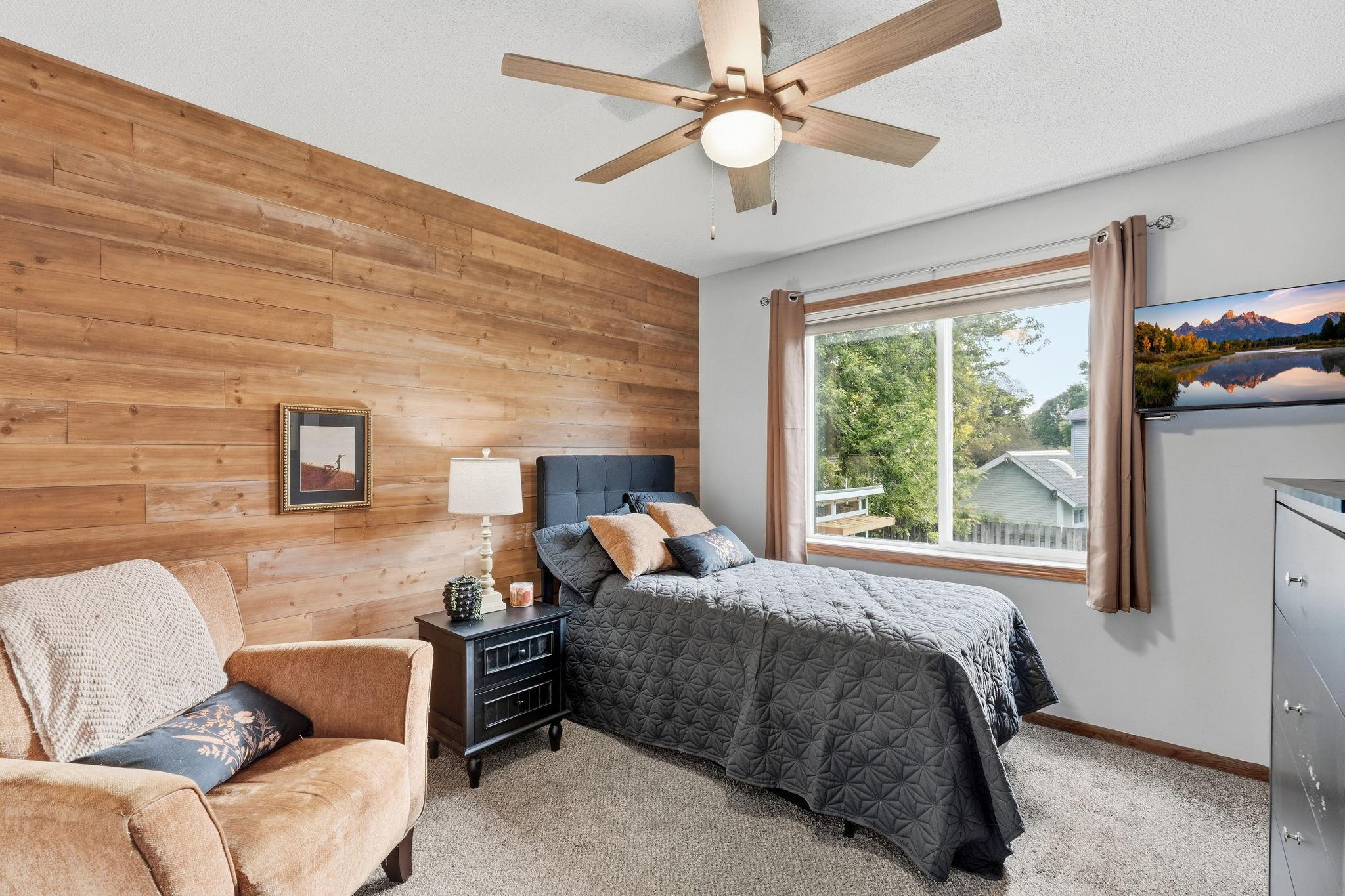 Primary bedroom with accent wall.