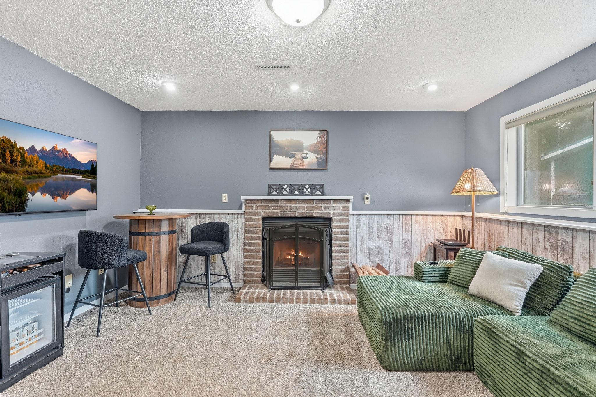 Lower level features cozy family room with gas fireplace, updated 3/4 bathroom, and 4th bedroom.
