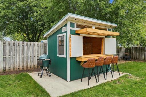 Newly added storage shed can be opened for a backyard entertaining bar. How cool is this!
