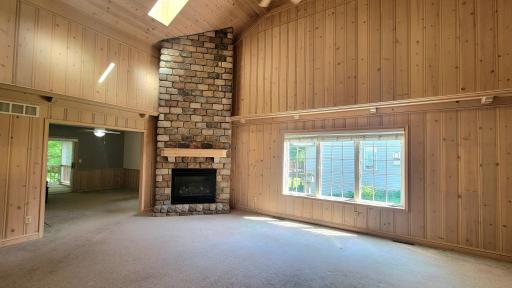 Living room with stone fireplace